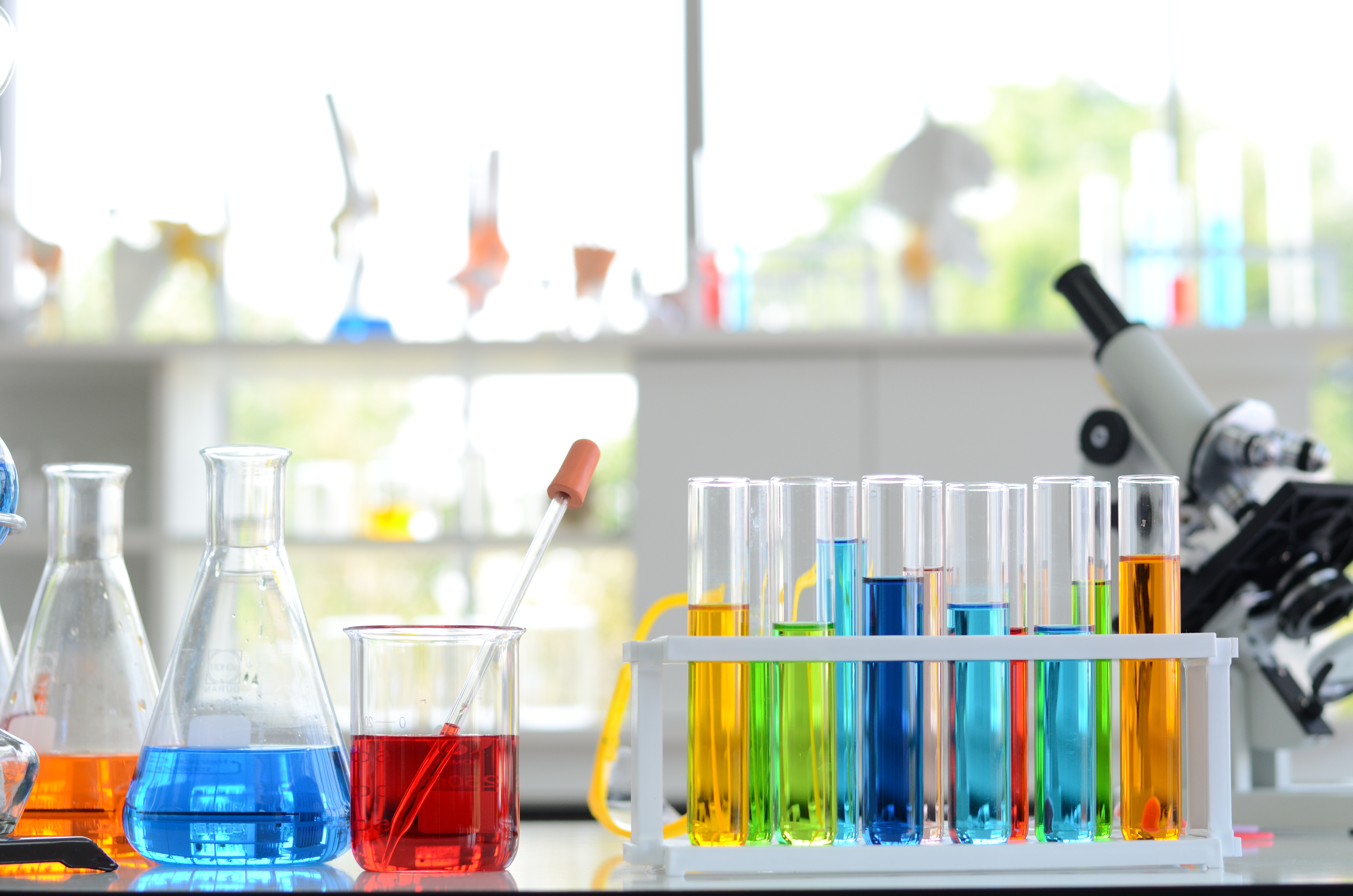 Industrial Chemicals — laboratory colorful reagents and test tubes